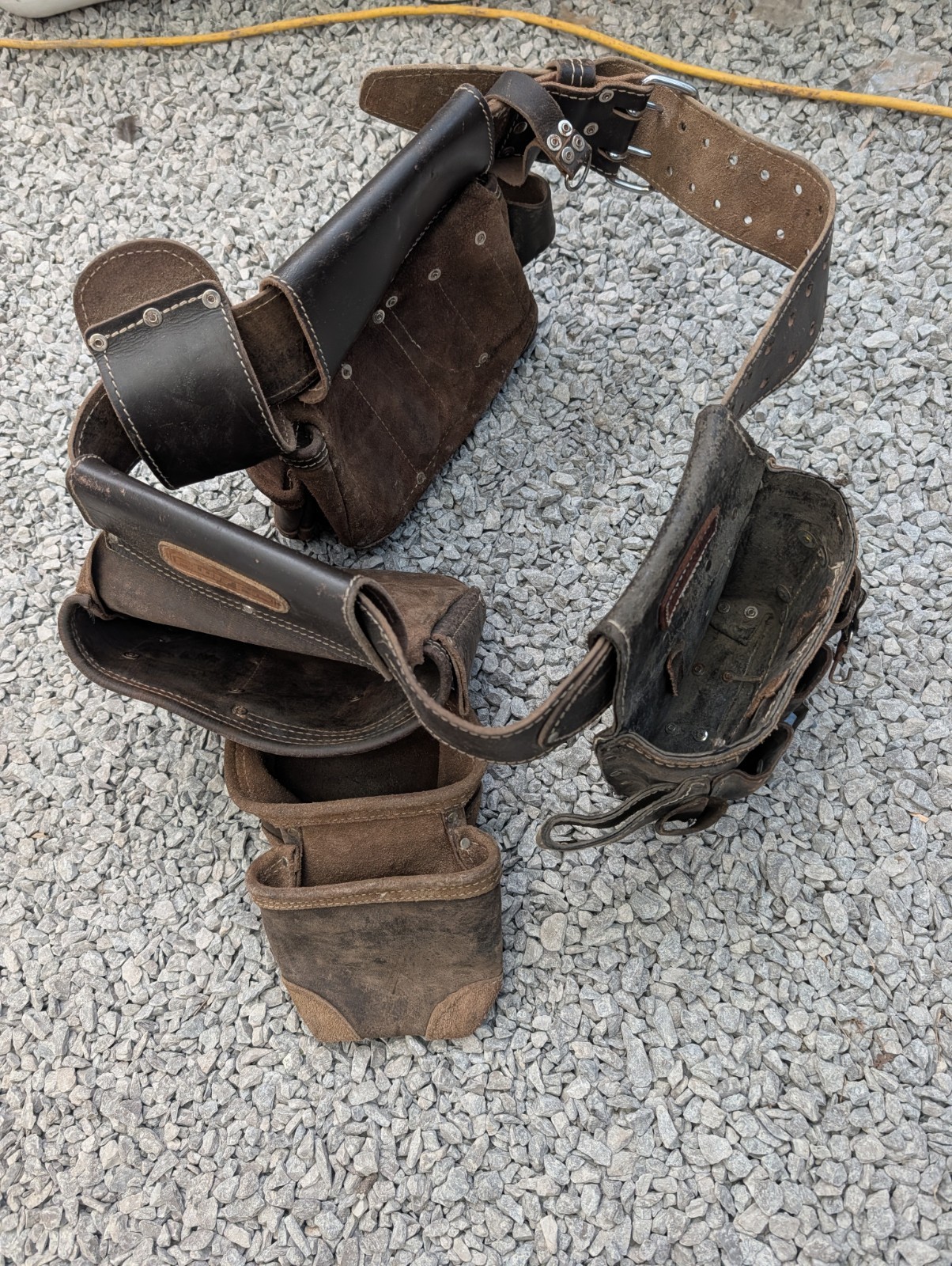AWP HP brand carpentry tool belt featuring two pouches and one Craftsman pouch.