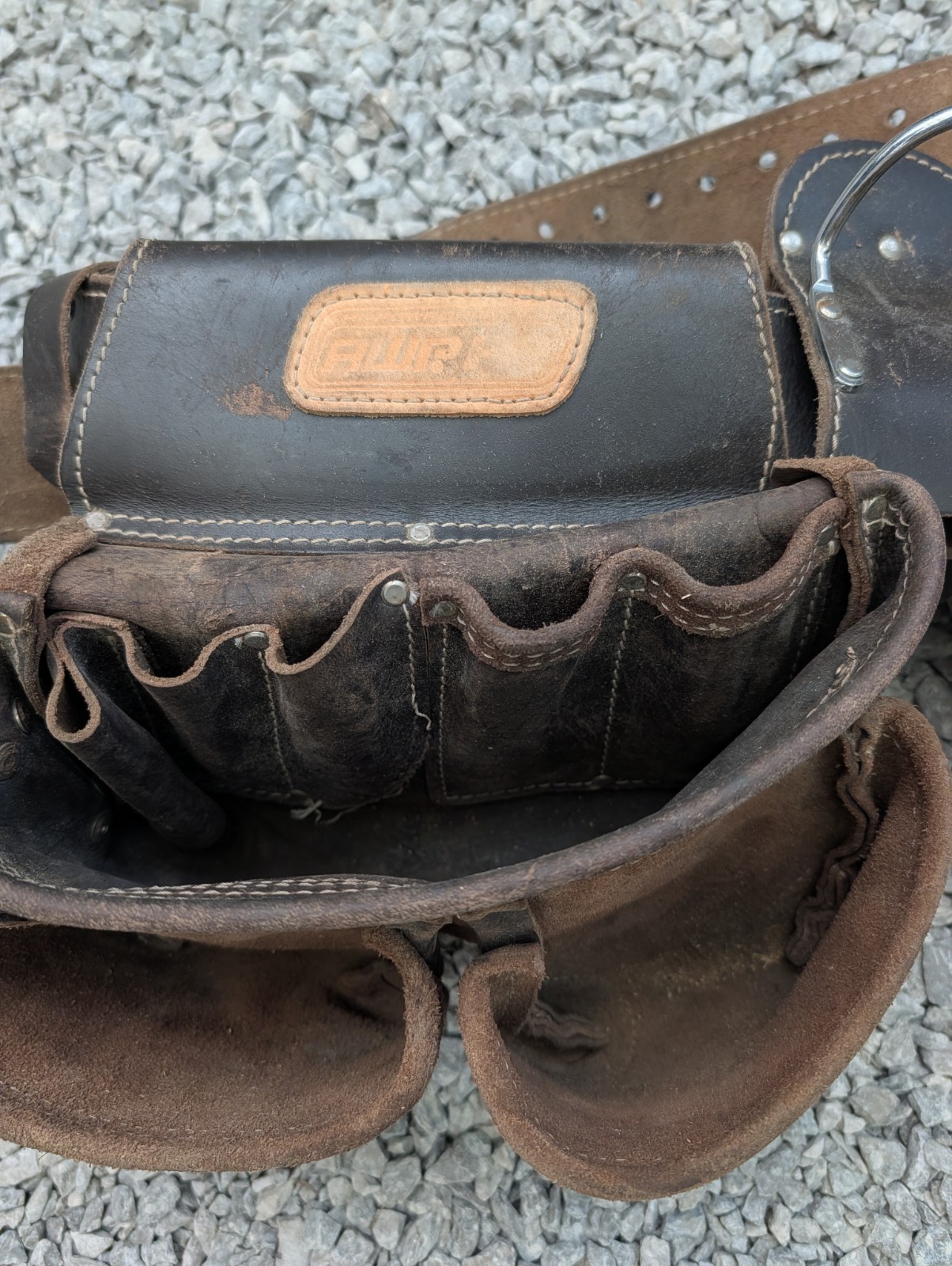 AWP HP brand carpentry tool belt featuring two pouches and one Craftsman pouch.