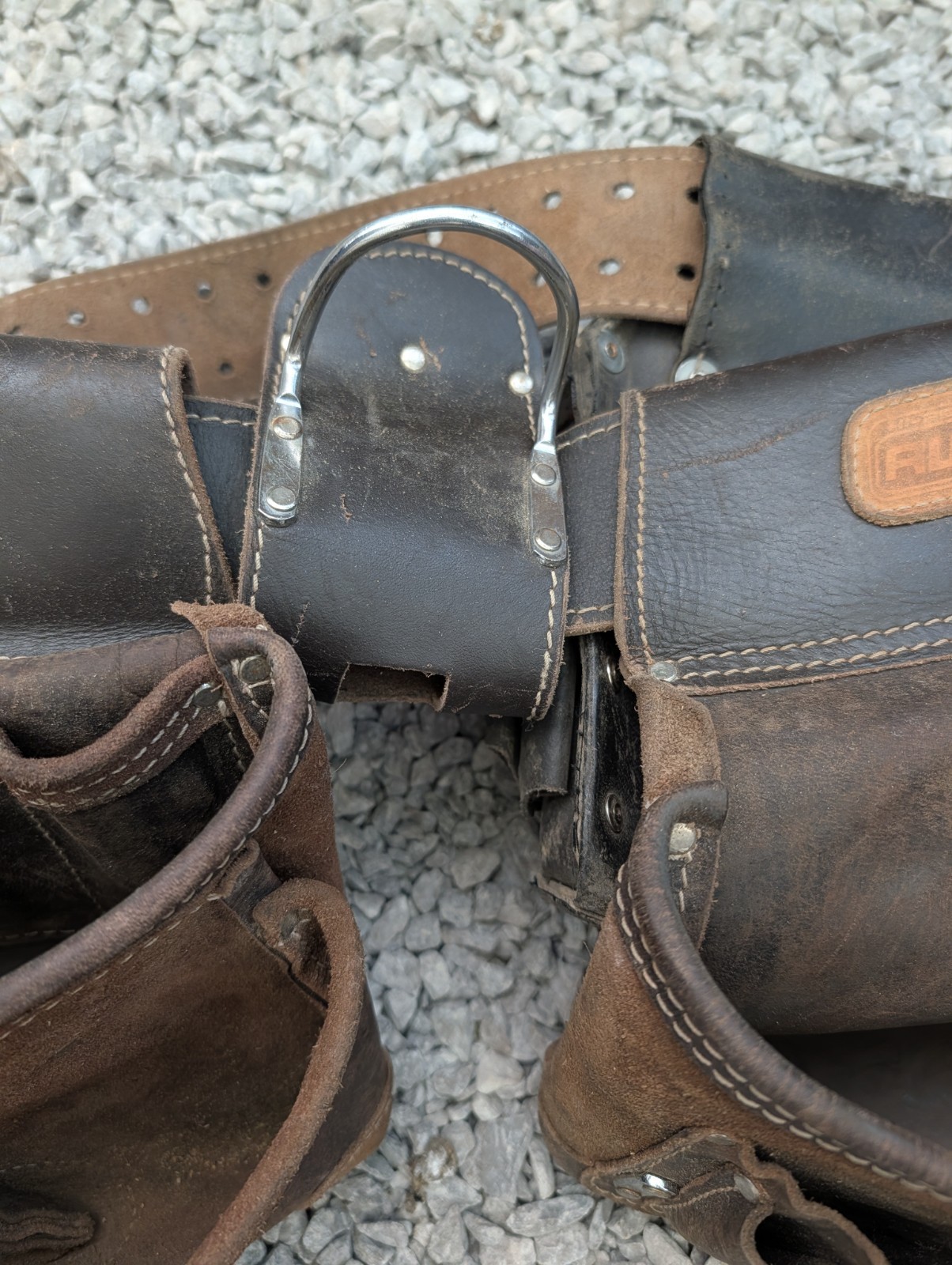 AWP HP brand carpentry tool belt featuring two pouches and one Craftsman pouch.