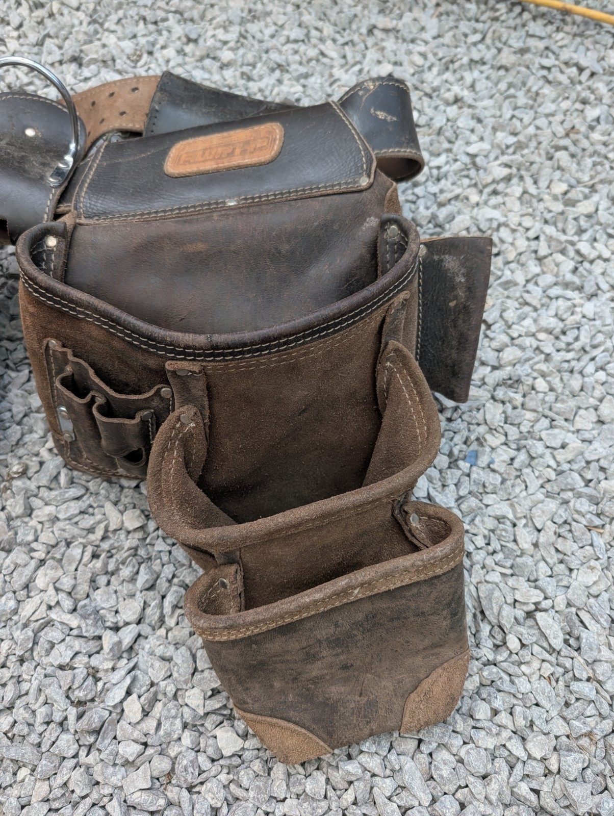 AWP HP brand carpentry tool belt featuring two pouches and one Craftsman pouch.