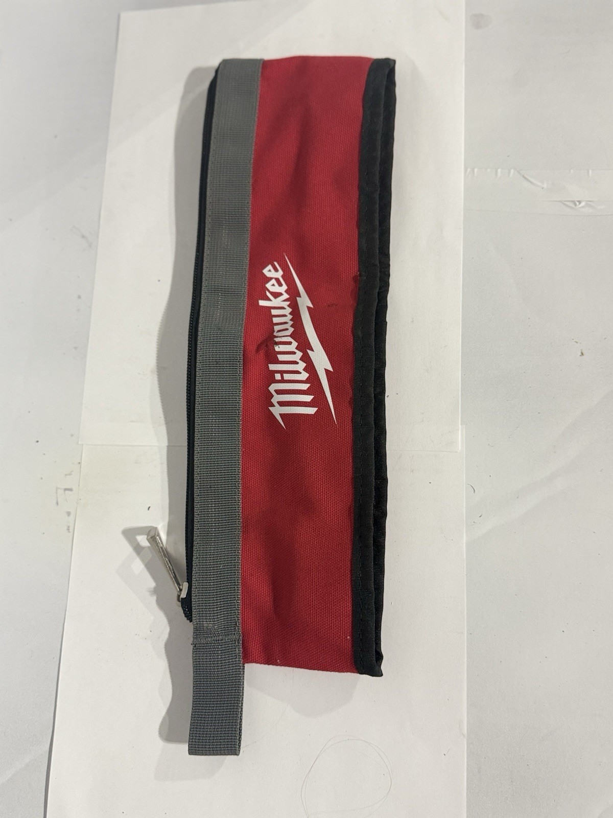 Milwaukee M12 Fuel Zippered Fabric Tool Bag w/ M12 charger and carrying bag.